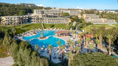 an aerial view of a resort with a pool and palm trees at Kresten Palace Hotel in Kallithea Rhodes