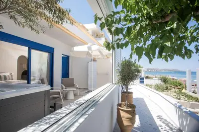 a house with a balcony with a view of the ocean at Dimitra Boutique Rooms in Faliraki