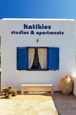 a building with a sign that says kittitas studios and apartments at Katikies Studios & Apartments in Lardos