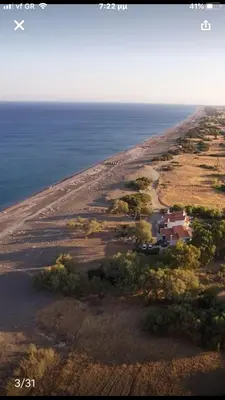 an aerial view of a house next to the ocean at Vamare Beachfront House in Gennadi