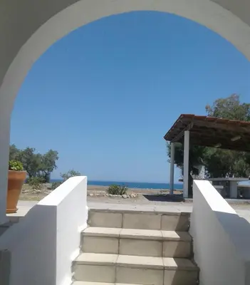 a stairway to the beach with a view of the ocean at Vamare Beachfront House in Gennadi