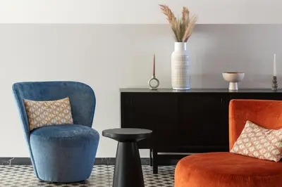 a living room with two chairs and a table at Paralos Rodos Lifestyle in Kolimbia