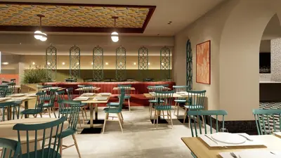a restaurant with tables and chairs and a bar at Paralos Rodos Lifestyle in Kolimbia