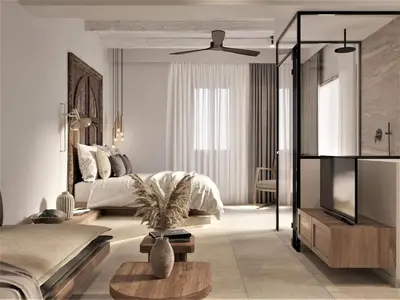 a bedroom with a bed and a table in it at F Fine Suites - Adults Only in Líndos