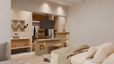 a living room with a couch and a tv at F Fine Suites - Adults Only in Líndos