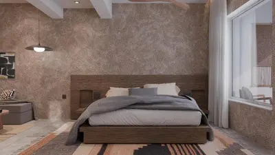 a bedroom with a bed with a wooden headboard at F Fine Suites - Adults Only in Líndos