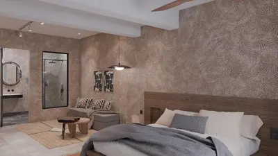 a bedroom with a bed and a living room at F Fine Suites - Adults Only in Líndos
