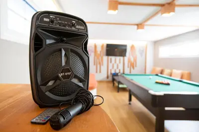 a gaming system sitting on a table next to a pool table at Afantou Golf Luxury Villa in Afantou
