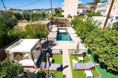 an overhead view of a backyard with a swimming pool and lawnitures at Afantou Golf Luxury Villa in Afantou