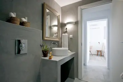 a bathroom with a sink and a mirror at Elements Villas in Lardos