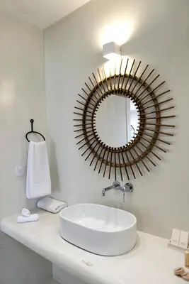 a bathroom with a sink and a mirror on the wall at Elements Villas in Lardos