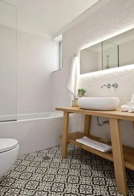 a bathroom with a sink and a toilet and a tub at Elements Villas in Lardos