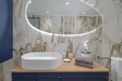a bathroom with a round sink and a mirror at Sea and the city in Rhodes Town