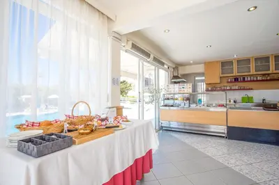 a kitchen with a table with food on it at Irinna Hotel-Apartments in Faliraki