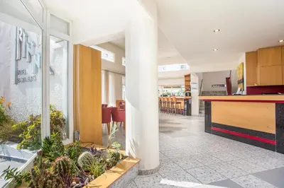 a kitchen and living room with plants in a house at Irinna Hotel-Apartments in Faliraki