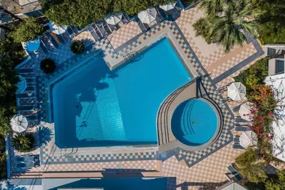 an overhead view of a large swimming pool at Irinna Hotel-Apartments in Faliraki
