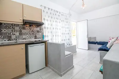 a kitchen with a sink and a counter top at Len Art Alternative Studios in Faliraki