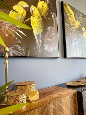 two yellow birds are sitting on a wall at FlyViewFlatsGOLD PrivateHotTub with SeaView in Rhodes Town