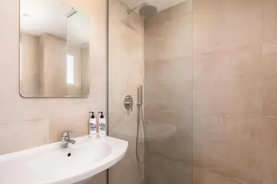 a bathroom with a sink and a shower at GOJI Vegan Hotel in Ialyssos