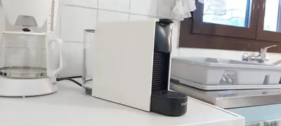 a hair dryer sitting on top of a kitchen counter at Country House in Pastida