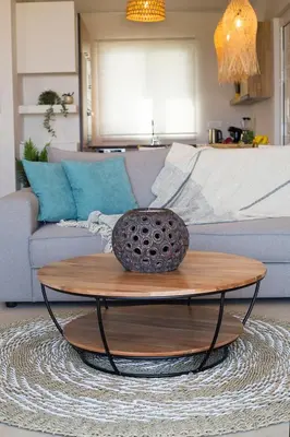 a coffee table in a living room with a couch at Muses of art Villas in Afantou