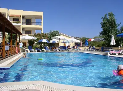 a swimming pool with a frisbee in the water at Summer Memories Aparthotel in Pefki Rhodes