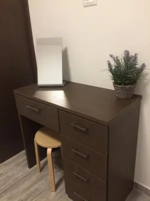 a black desk with a plant on top of it at Melita Apartment Seaside in Haraki