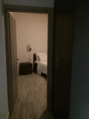 a door leading to a bedroom with a bed at Melita Apartment Seaside in Haraki