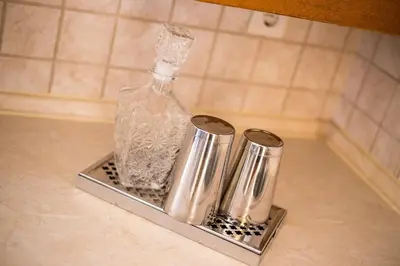 a bottle sitting on a shelf in a kitchen counter at Villa Kora in Kallithea Rhodes