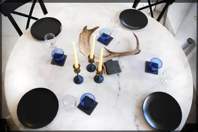 a white table with wine glasses and antlers on it at Villa Kora in Kallithea Rhodes
