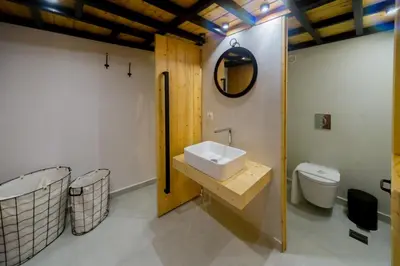 a bathroom with a sink and a toilet at Villa Myrto in Líndos