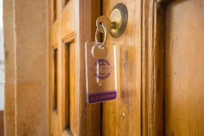 a lock on a door with a tag on it at Villa Myrto in Líndos