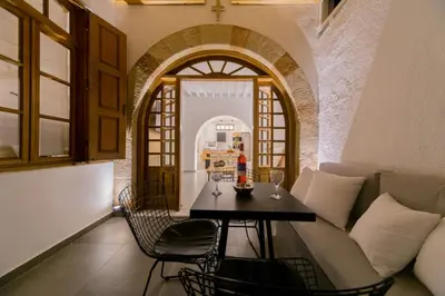a living room with a couch and a table at Villa Myrto in Líndos