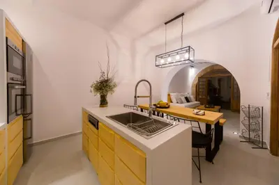 a kitchen with a sink and a counter top at Villa Myrto in Líndos