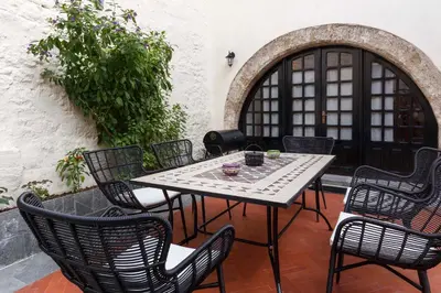 a table and chairs sitting on a patio at Belvedere Medieval Villa in Rhodes Town