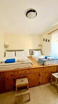 two beds sitting next to each other in a bedroom at Sea House Lahania in Lachania