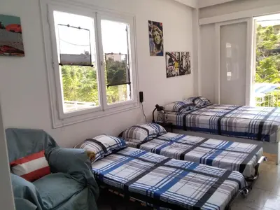 a living room with two beds and a couch at Apollon Apartments H-3 H-4 in Rhodes Town