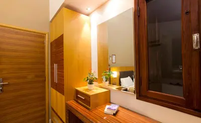 a bathroom with a sink and a mirror at Pefkos Beach Studios & Apartments in Pefki Rhodes