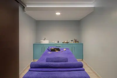 a room with a purple table and a blue cabinet at Sol Cosmopolitan Rhodes in Ixia