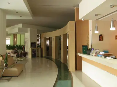 a lobby of a hospital with a glass floor at Cathrin Hotel in Faliraki