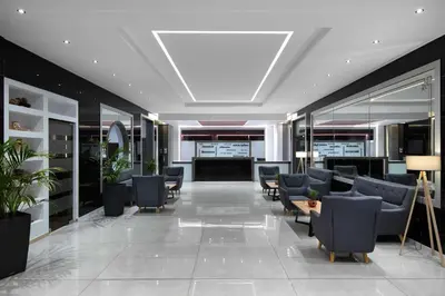 a lobby with couches and chairs in a building at Virginia Family Resort in Kallithea Rhodes