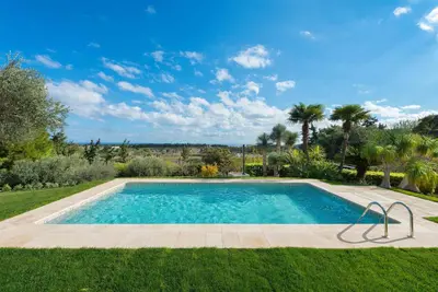 a swimming pool in the middle of a yard at Blue & Green View Villa in Asgourou