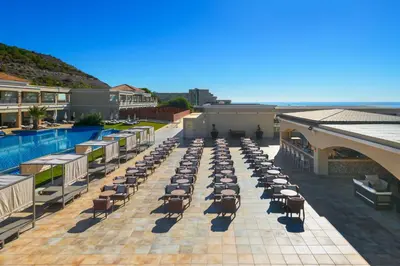 an overhead view of a patio with chairs and a pool at La Marquise Luxury Resort Complex in Faliraki