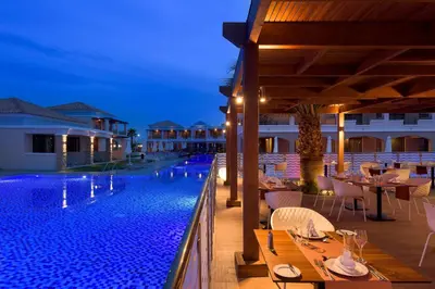 a resort with a swimming pool at night at La Marquise Luxury Resort Complex in Faliraki