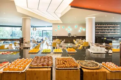 a buffet line with different types of food on display at Doreta Beach in Theologos