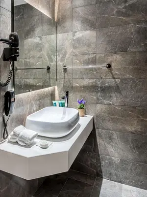 a bathroom with a sink and a shower at Doreta Beach in Theologos