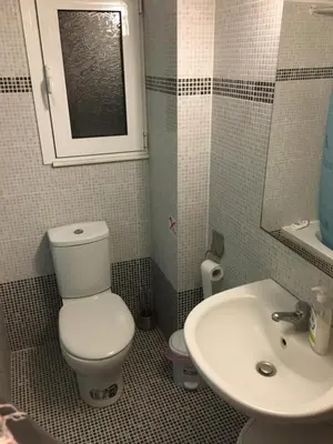 a bathroom with a toilet and a sink at Matrel Home in Rhodes Town