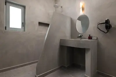 a bathroom with a sink and a mirror at Southrock Villas in Lachania