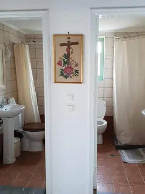 a bathroom with a toilet and a sink at Sea Stars ,Villas Danezis in Symi