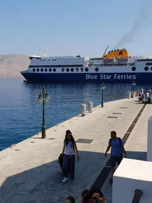 a blue star ferries cruise ship in the water at Sea Stars ,Villas Danezis in Symi